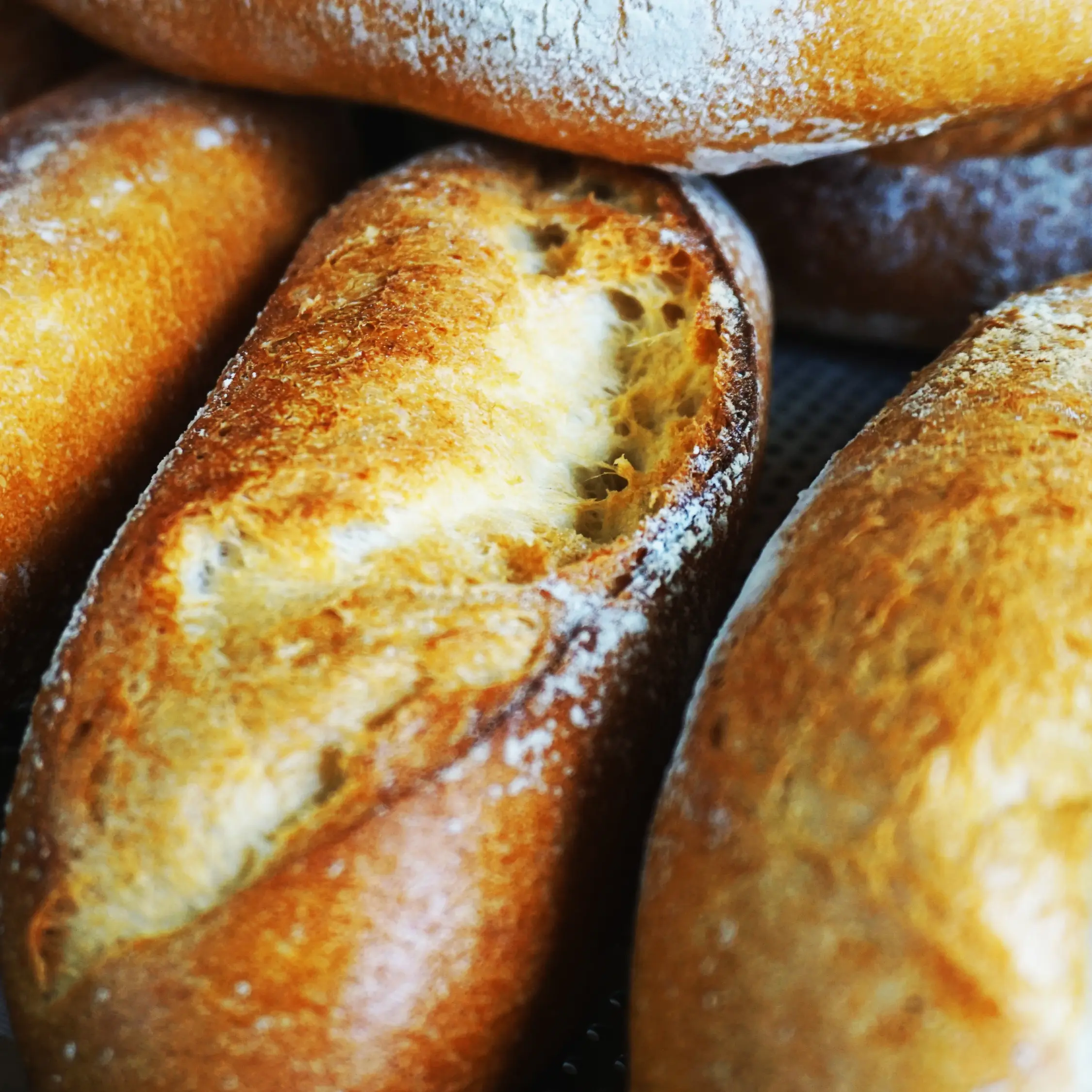 Golden crusty artisan bread loaves baked fresh daily at Vonado Cookie and Bread in Hanoi