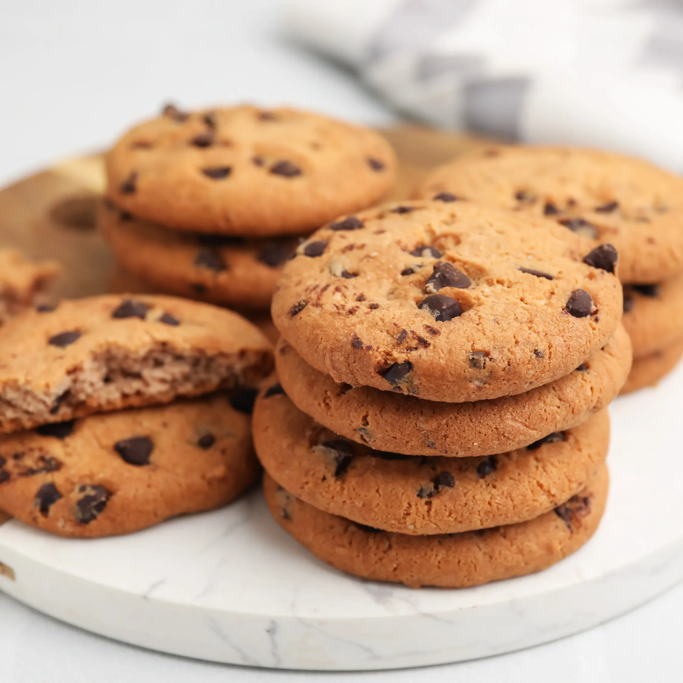 Homemade chocolate chip cookies stacked on a marble board at Vonado Korean Bakery in Hanoi